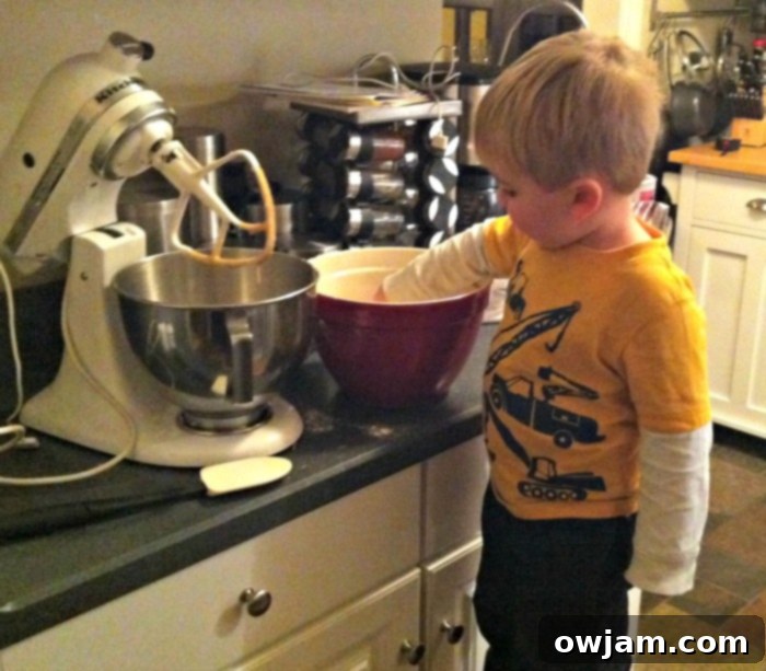 Young boy, Will, mixing ingredients in a bowl