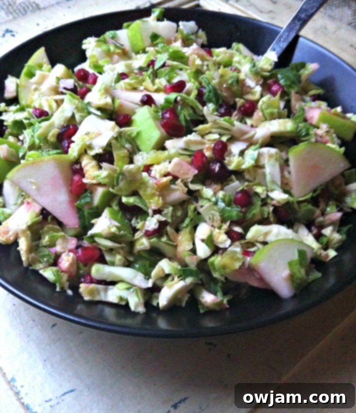 Crisp Shaved Brussels Sprout Salad with Apple and Pomegranate 3 Close-up of fresh Brussels sprouts ready to be shaved for the salad recipe.
