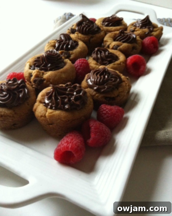 Unbaked Pillsbury Gluten-Free cookie dough balls arranged in a mini muffin tin