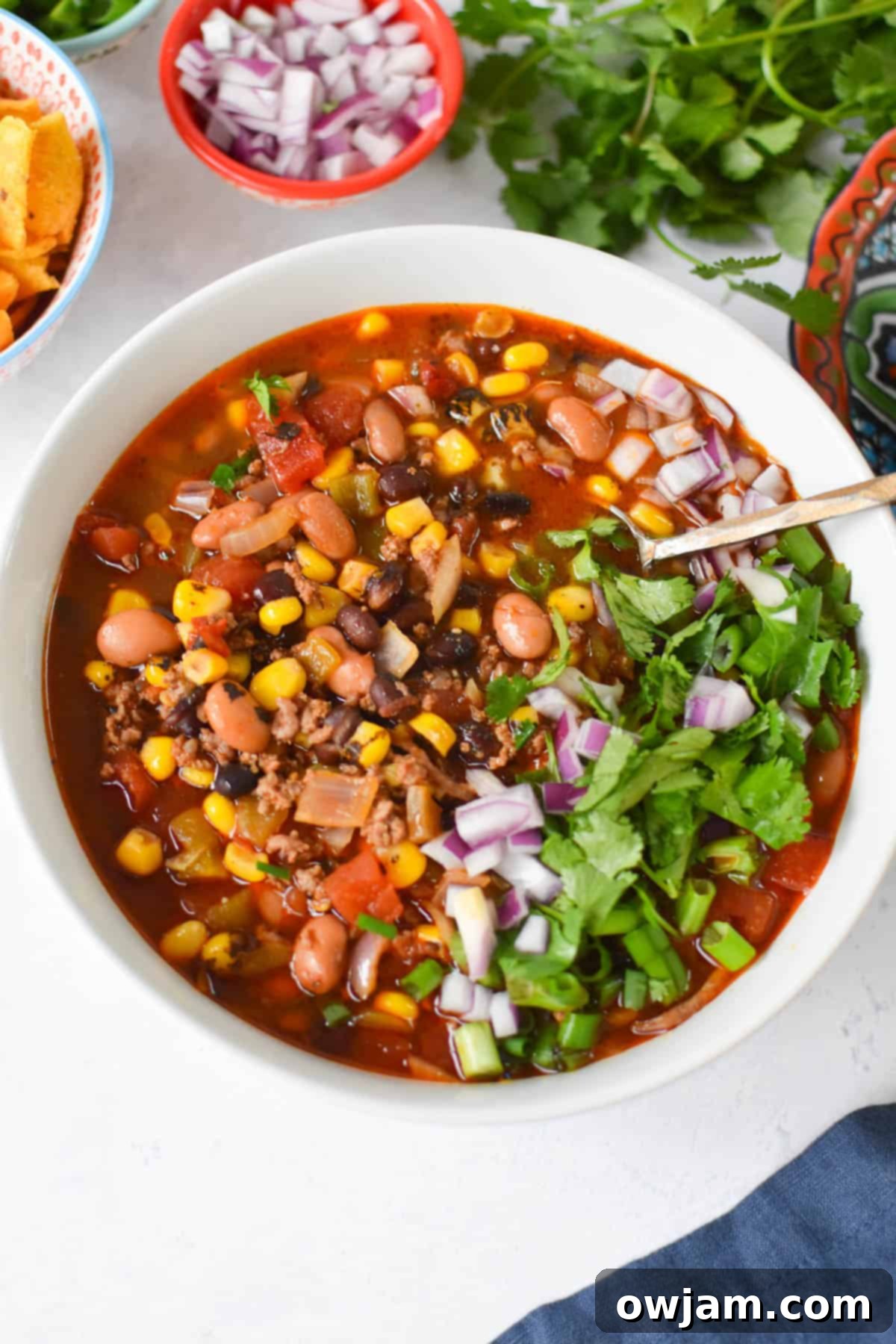 Slow Cooker Taco Soup Recipe in a white bowl with a slice of lime