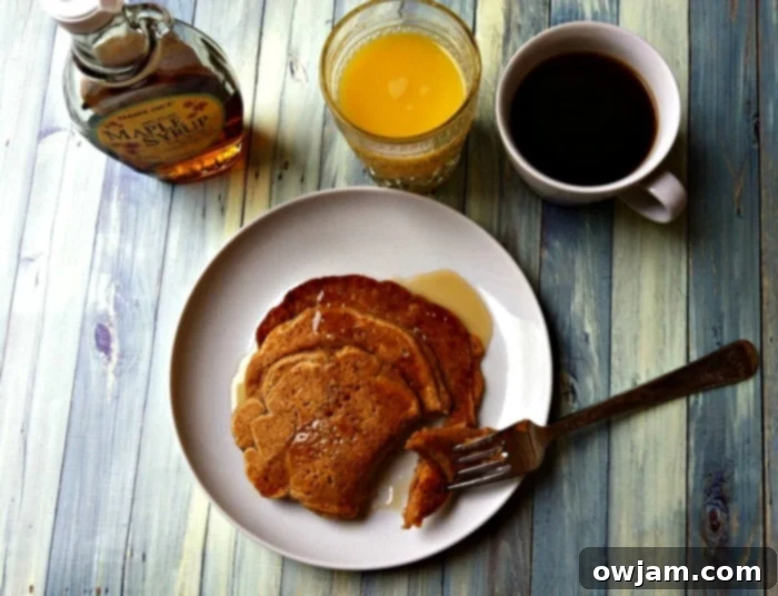 Close-up of Sweet Potato Cinnamon Pancakes with a fork