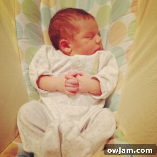 Baby Andrew's tiny hands clasped together as if in prayer