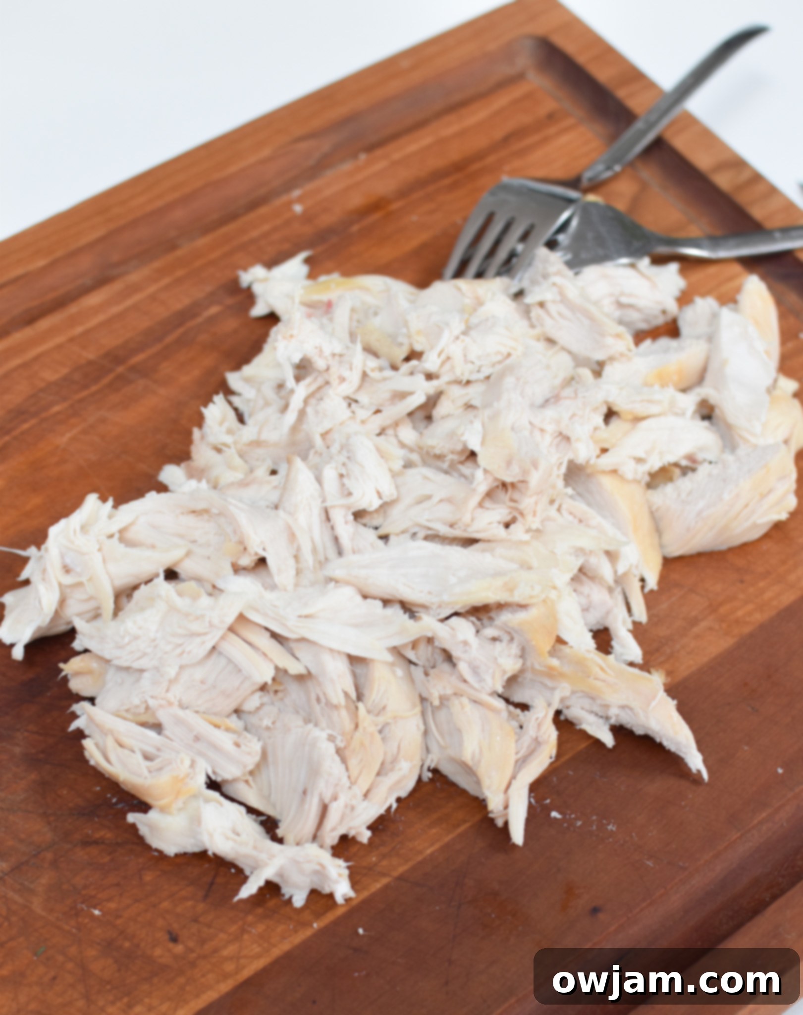 Lemon Chicken Orzo chicken on cutting board.