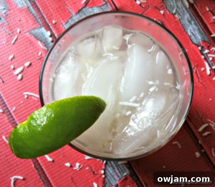 Summer Spiked Raspberry Lime Coconut Water Cocktail on a Patio