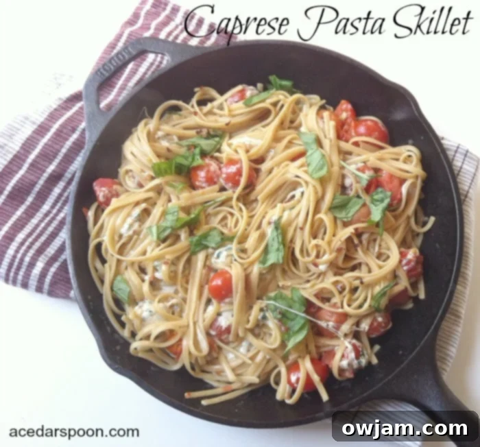 Delicious Caprese Pasta Skillet with fresh basil and cherry tomatoes, ready in 30 minutes