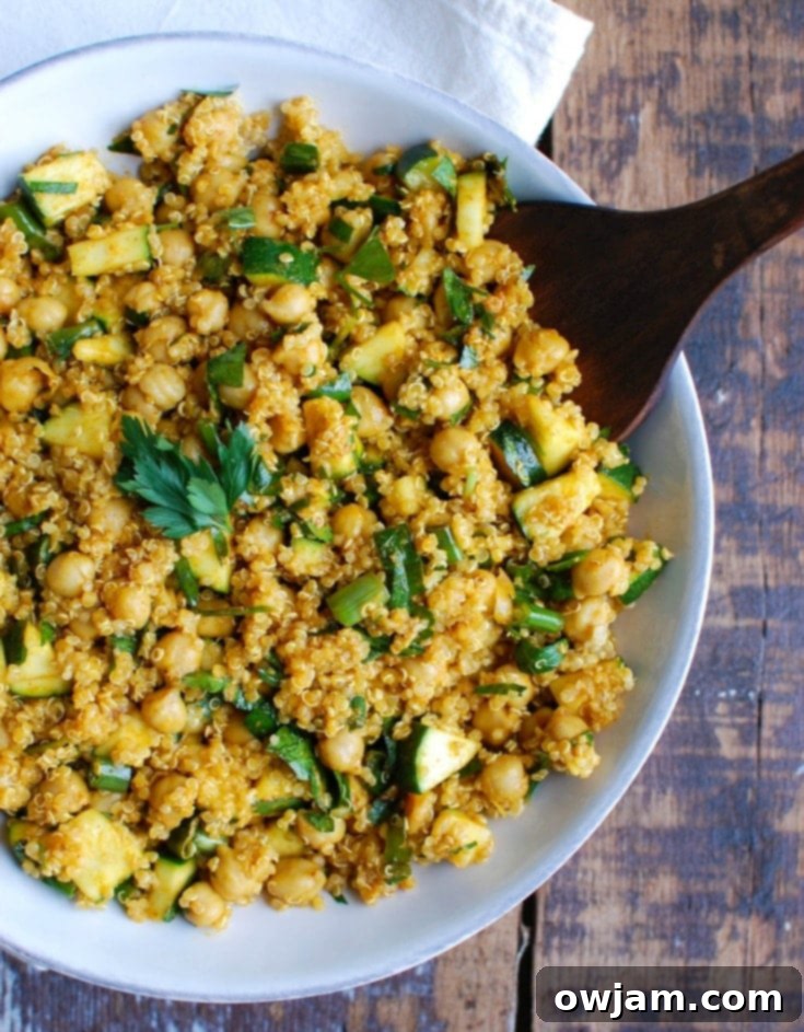 Zesty Zucchini Quinoa Chickpea Bowl 4 Zucchini Chickpea Quinoa Salad with spoon