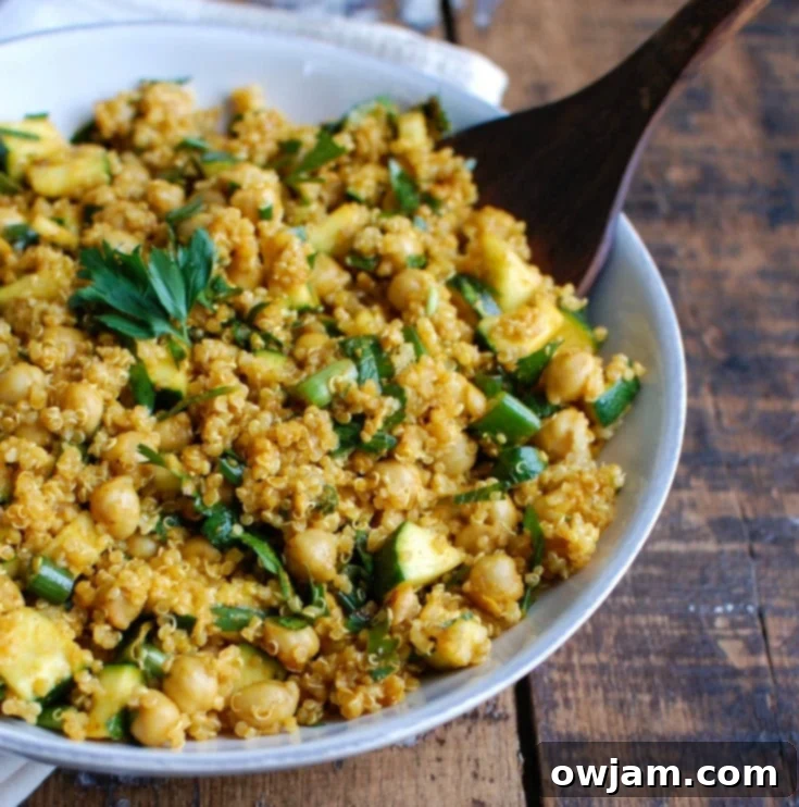 Zesty Zucchini Quinoa Chickpea Bowl 5 Zucchini Chickpea Quinoa Salad with spoon
