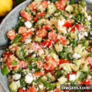 Bright Mediterranean Quinoa Salad 6 Tomato Cucumber Feta Quinoa Salad in a serving dish, recipe card image