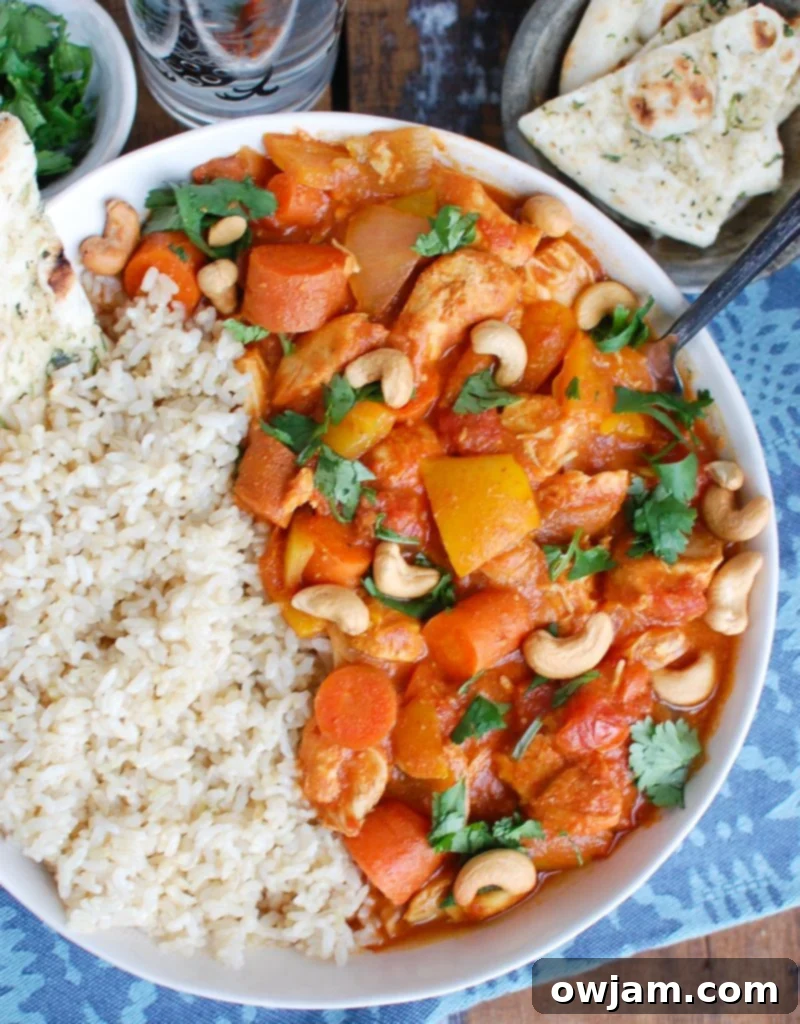 Set It and Forget It Chicken Curry 4 Slow Cooker Coconut Curry Chicken with Spoon