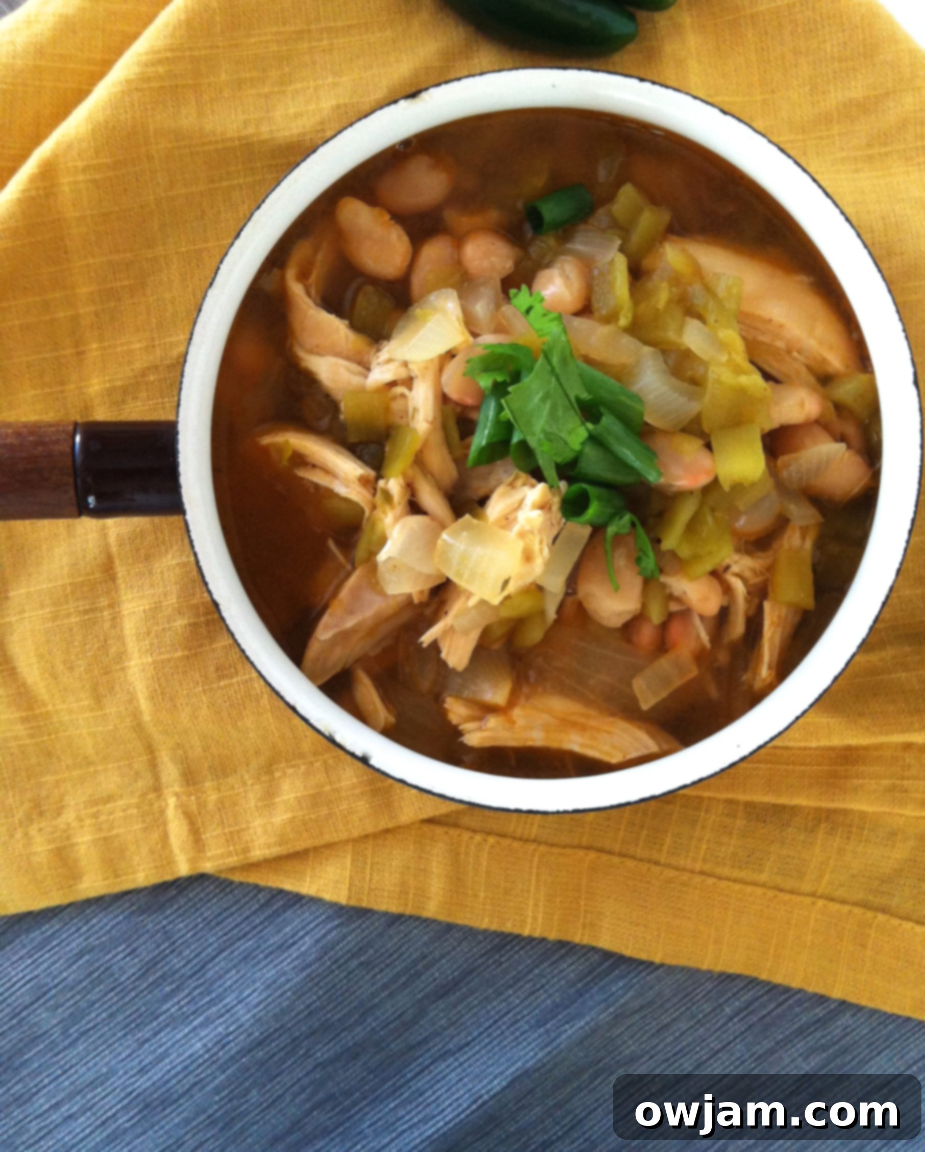 Creamy White Chicken Chili served in a bowl with toppings.