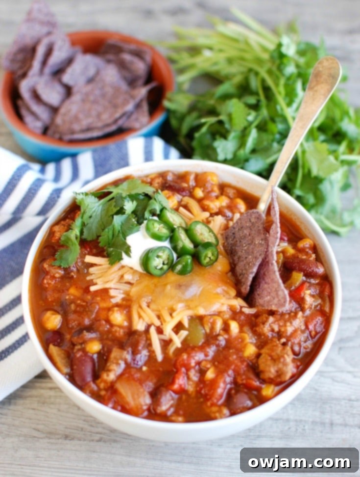 Slow Cooker Turkey Chili garnished with fresh cilantro and a lime wedge