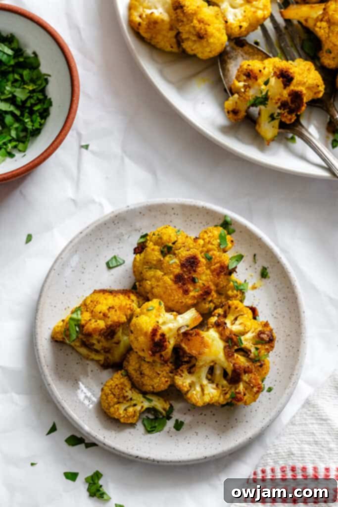 Golden Curry Roasted Cauliflower 3 Close-up of Curry Roasted Cauliflower on a small white plate, ready for serving