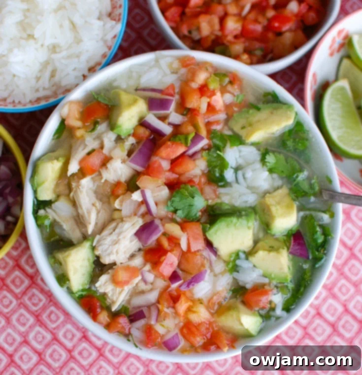 Zesty Slow Cooker Mexican Chicken Lime Soup 6 Slow Cooker Mexican Chicken Lime Soup in a white bowl.