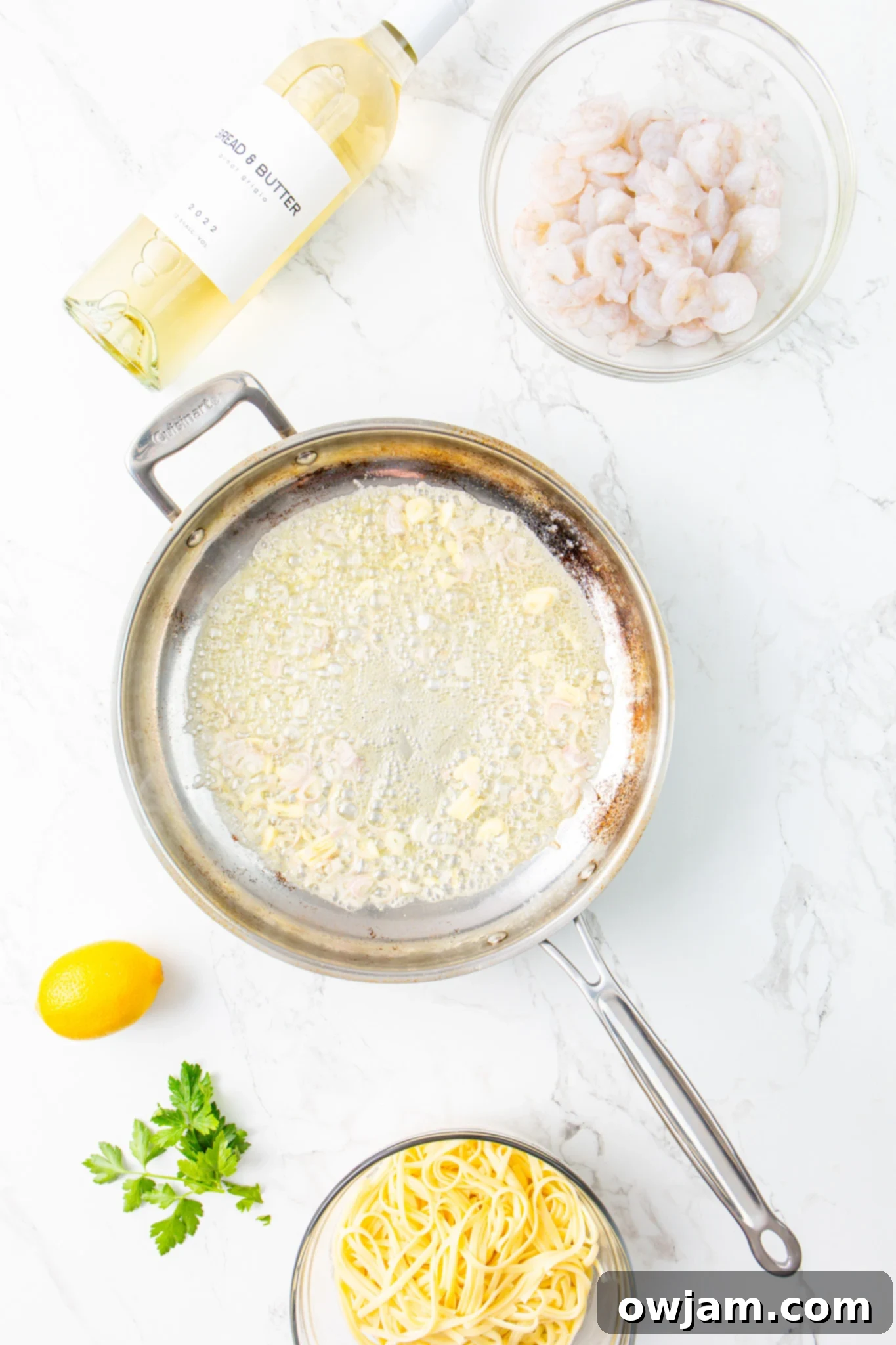 Zesty Lemon Garlic Shrimp Pasta 6 Onion sautéing in a skillet with butter for Lemon Garlic Shrimp Pasta.