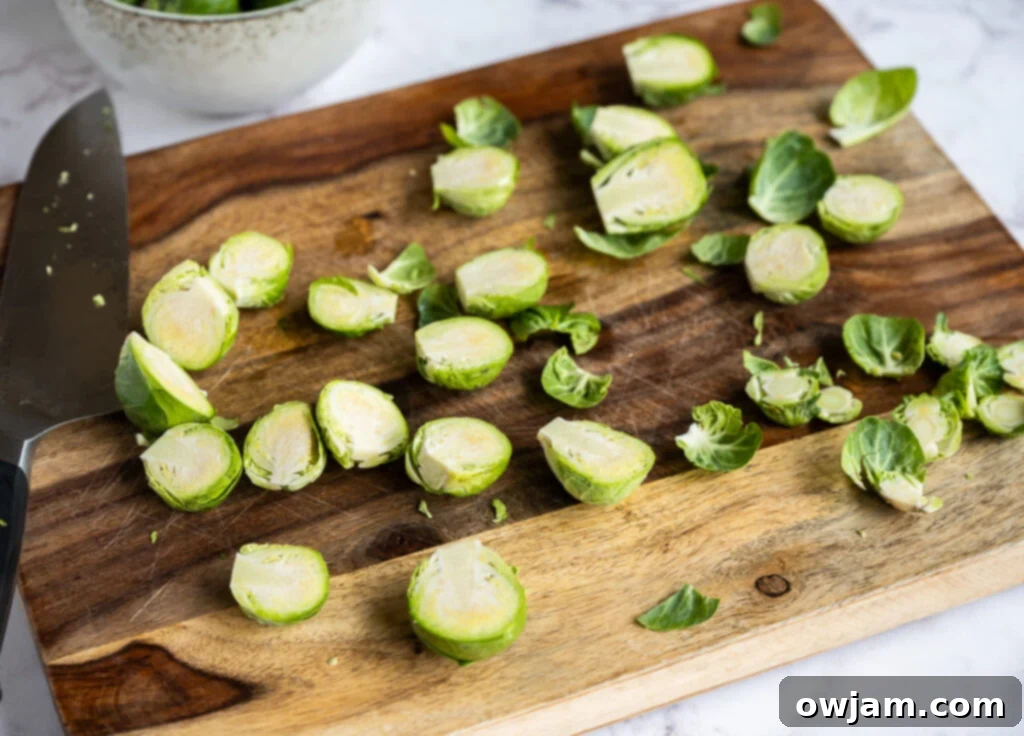 Bright Garlicky Brussels Sprouts 6 A bowl of freshly roasted Brussels sprouts topped with melted Parmesan