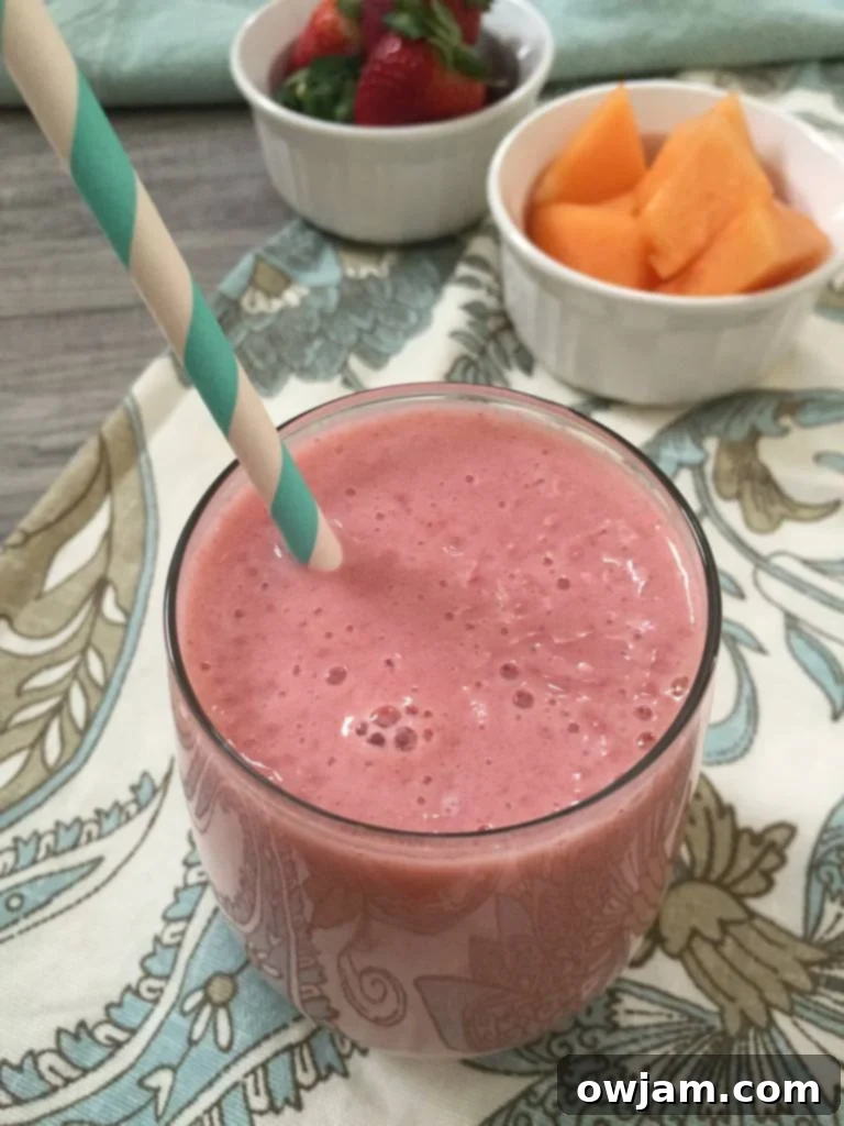 A refreshing Strawberry Cantaloupe Smoothie served in a glass, perfect for a morning boost or afternoon snack.
