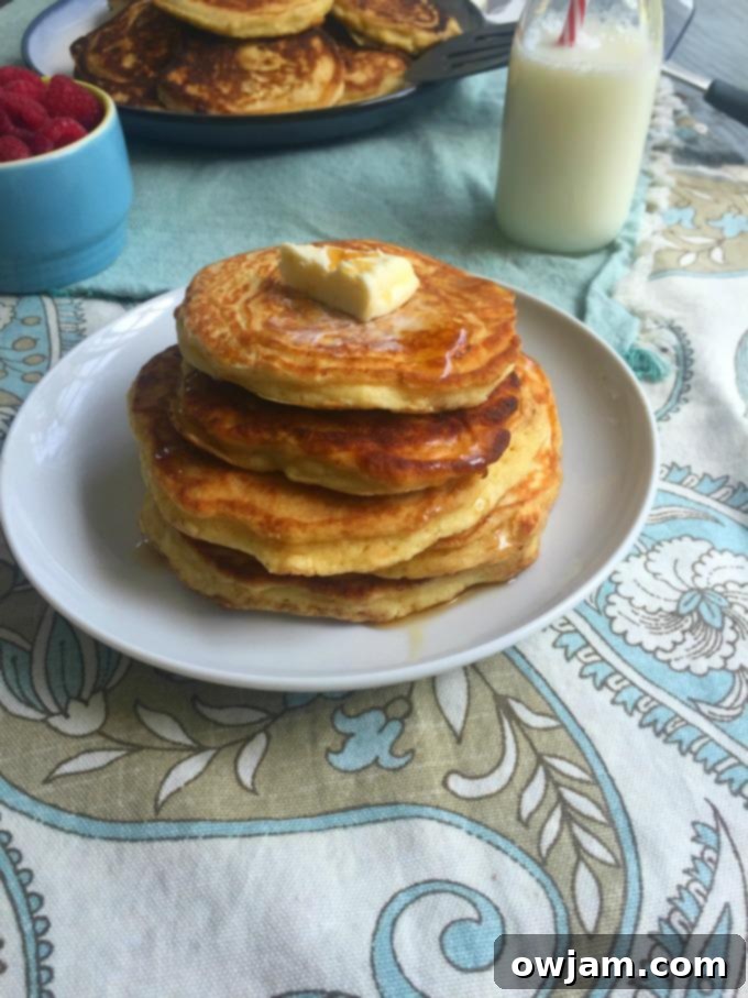 Tenderest Cardamom Pancakes - Golden brown stack with syrup
