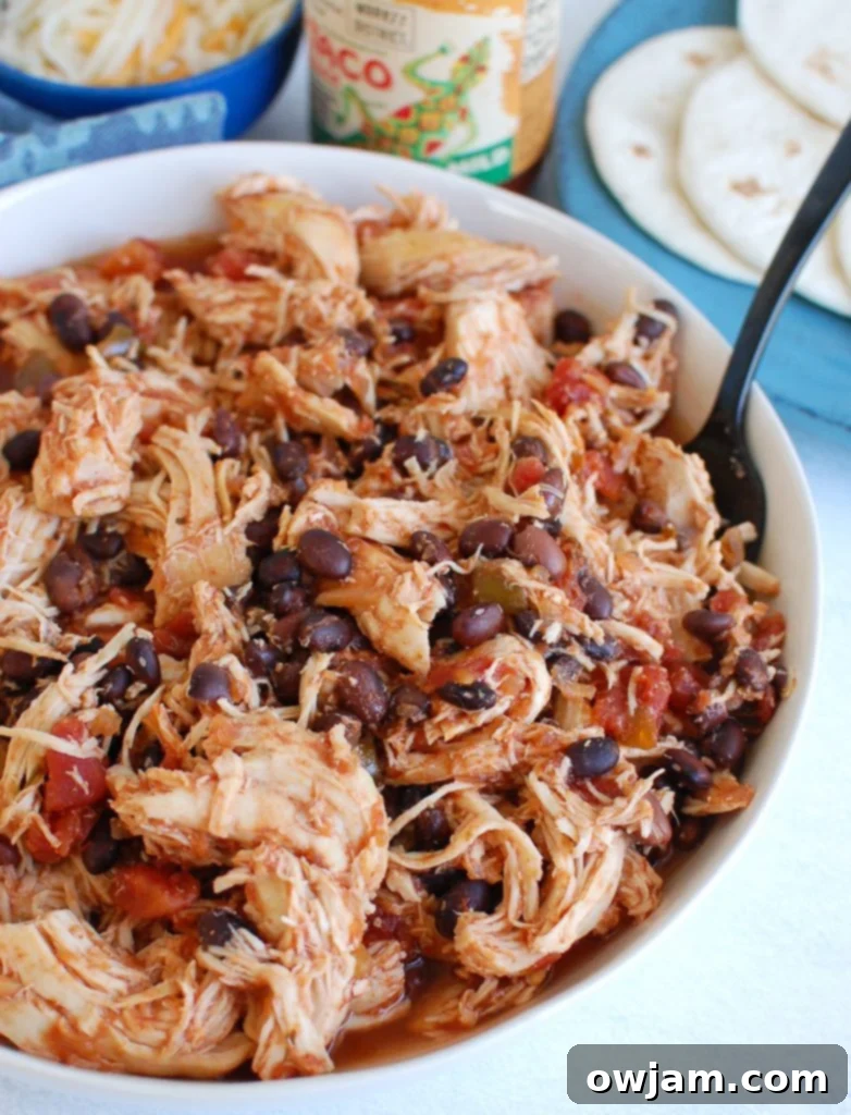 Slow Cooker Shredded Chicken in a white bowl
