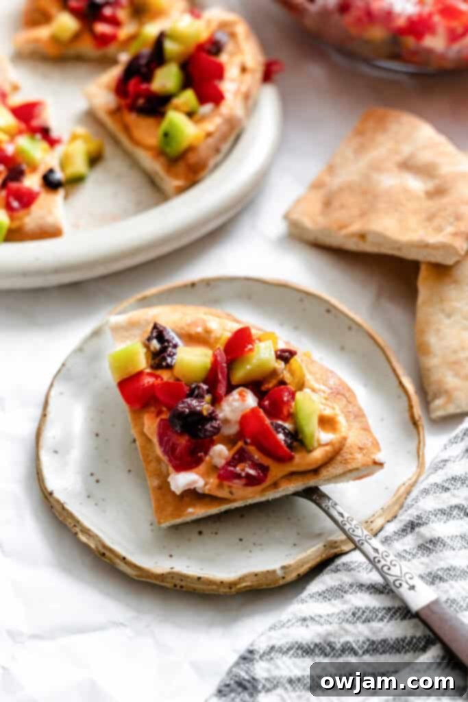 Loaded Hummus Pitas pita on fork