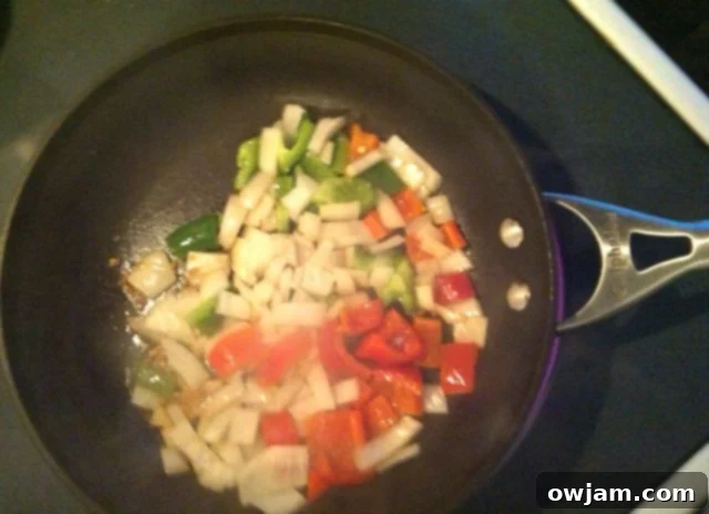Freshly chopped sweet white onion, green onion, red bell pepper, and green pepper for Pasta Goulash
