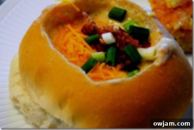 Thick and creamy Loaded Baked Potato Soup, generously topped with cheese and chives.