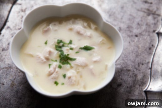 A bowl of traditional Greek Avgolemono Soup with tender chicken and a bright lemon flavor.