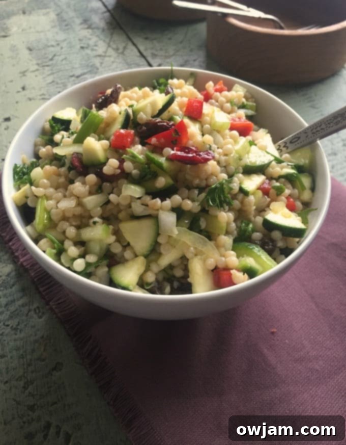 Zesty Pearl Couscous Salad 3 Fresh ingredients for Israeli Couscous Salad, highlighting the colorful vegetables and dried fruits