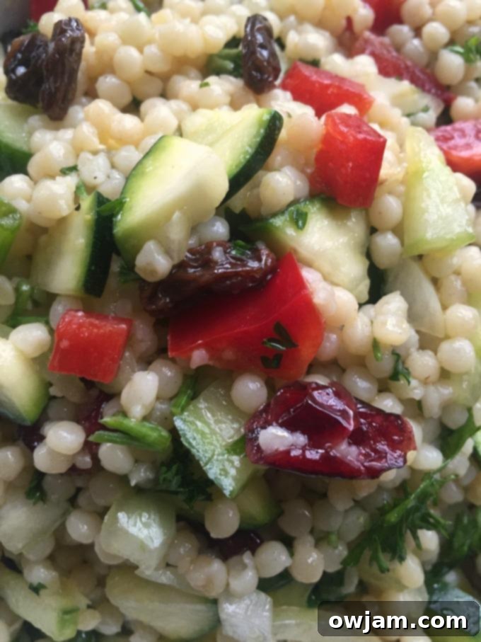 Zesty Pearl Couscous Salad 4 A close-up of Israeli Couscous Salad with Lemon Dressing, showing the texture of the couscous and fresh herbs