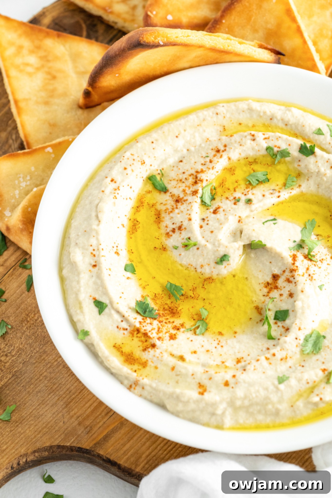 Baba Ghanoush garnished with fresh parsley and a drizzle of olive oil, ready to be enjoyed.