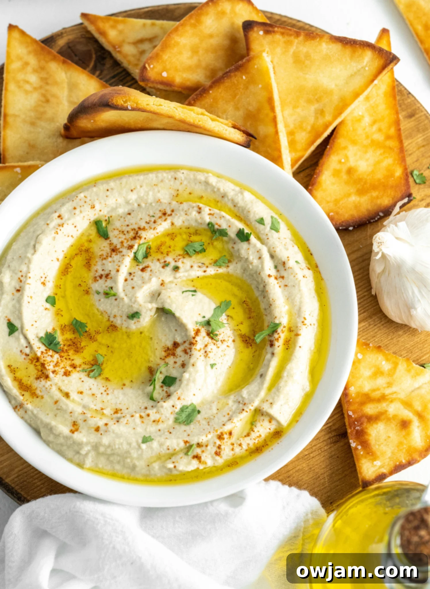 Close-up of creamy Baba Ghanoush in a white bowl, ready to be served.