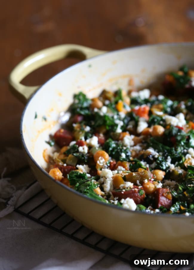 Spicy Chorizo Chickpea Skillet with kale, bell peppers, and cotija cheese.
