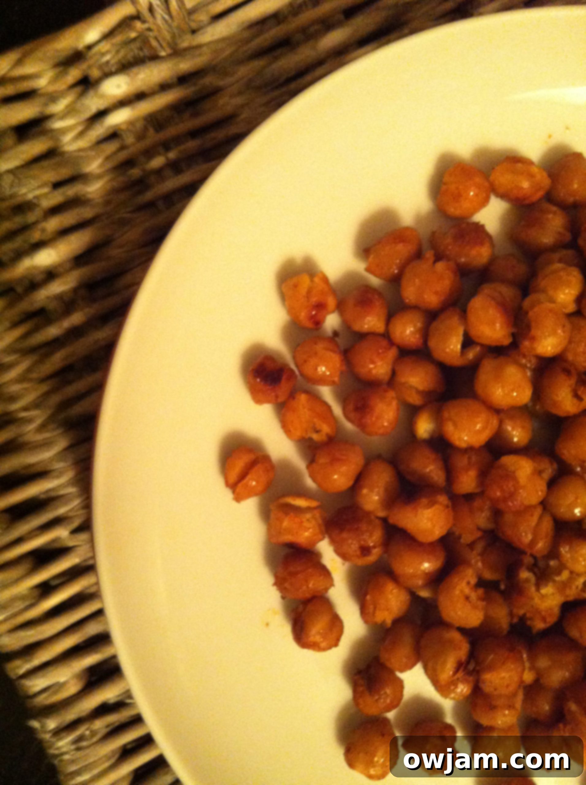 A bowl of perfectly roasted, golden brown chickpeas, ready to be served.