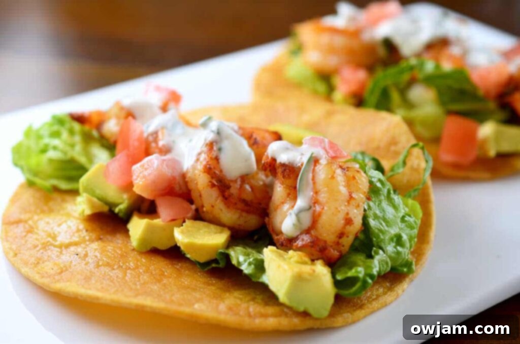 Delicious shrimp tacos with a creamy cilantro-lime sour cream sauce