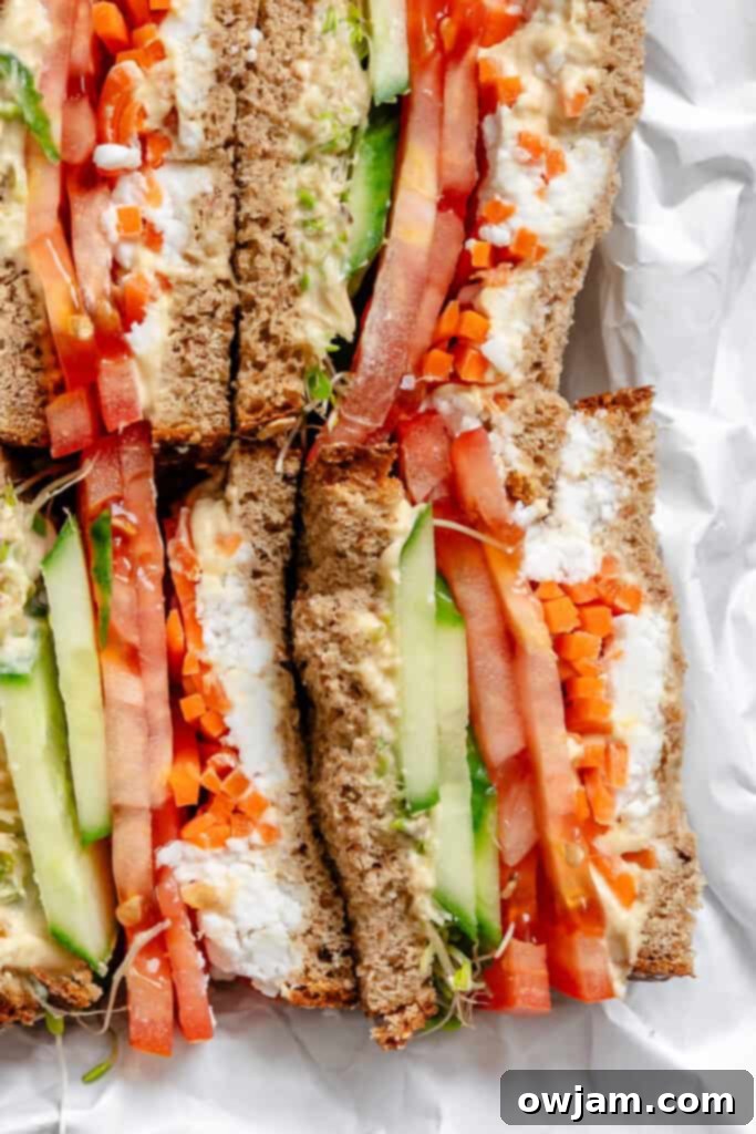 Mediterranean Garden Sandwich 5 Mediterranean Vegetable Sandwich cut in half, showcasing layers