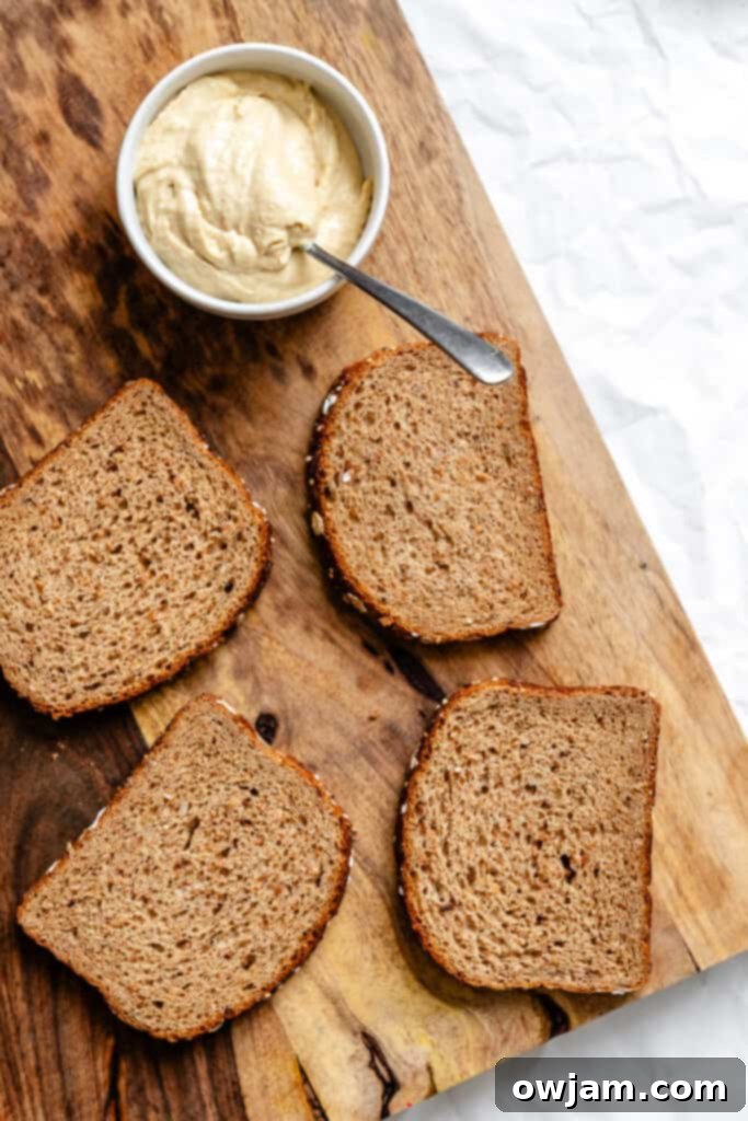 Mediterranean Garden Sandwich 6 Two slices of bread on a cutting board