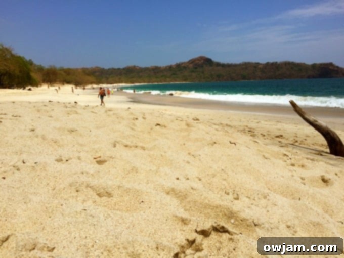 Playa Conchal with clear teal water and seashell sand