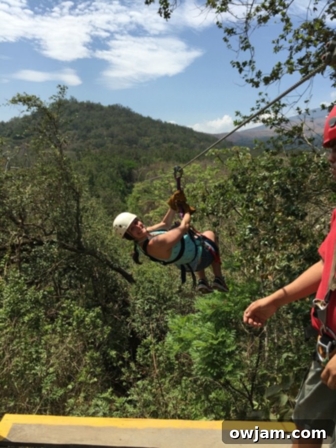 Couple ziplining through the jungle