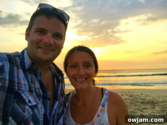 Couple watching sunset on Tamarindo beach