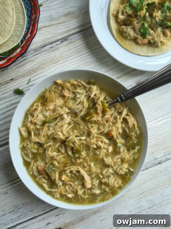 Slow Cooker Salsa Verde Chicken Tacos served with fresh toppings like cilantro and lime.