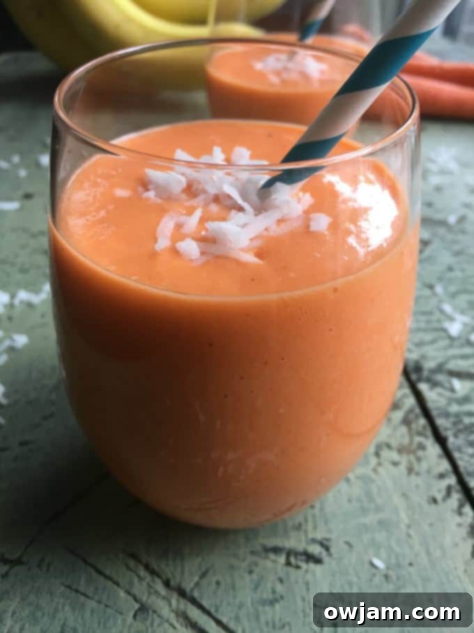 Golden Carrot Delight 4 A tall glass of Coconut Carrot Smoothie, a healthy beverage for any meal.