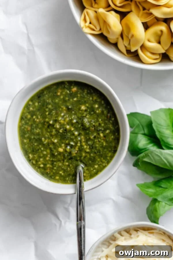 Speedy Cheesy Pesto Tortellini Dinner 5 a small bowl of pesto