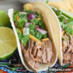 Flavorful Slow Cooker Shredded Beef Tacos 7 Slow Cooker Shredded Beef Tacos with garnishes for serving