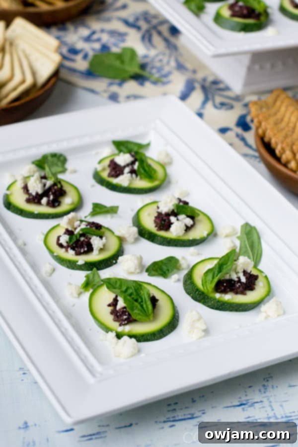 12 Mouthwatering Zucchini Recipes 13 Appetizing zucchini slices topped with olive tapenade and crumbled feta cheese.