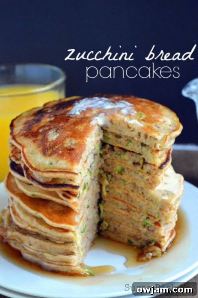 12 Mouthwatering Zucchini Recipes 10 Fluffy zucchini bread pancakes stacked high, perfect for a special breakfast.