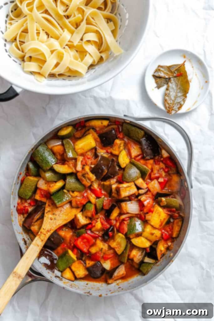 Ratatouille sauce simmering in a skillet, ready for pasta.
