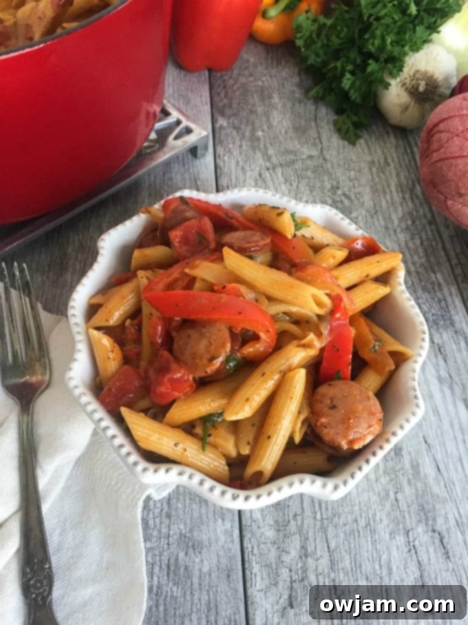 Close-up of a serving of One Pot Cajun Pasta, showcasing the creamy sauce and ingredients.