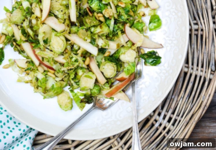 Crunchy Shredded Brussels Sprouts and Apple Salad, a light and healthy fall side dish with a refreshing vinaigrette