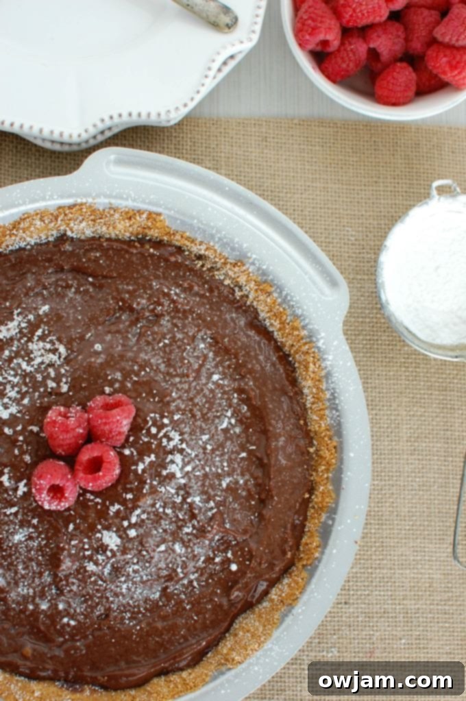 Decadent Dark Chocolate Raspberry Pie with Fresh Berries