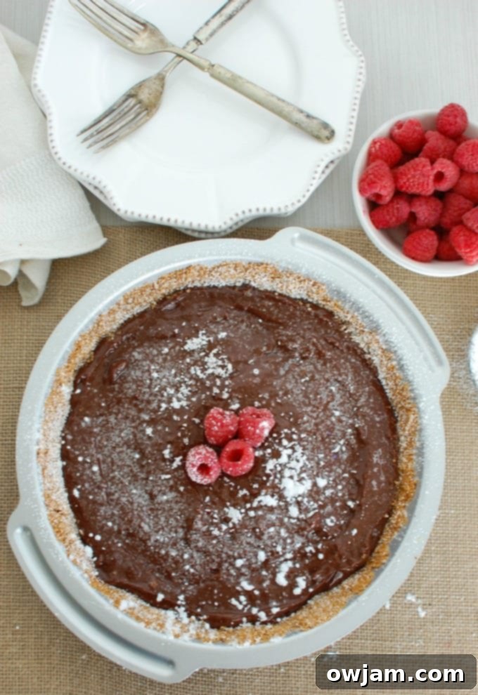A slice of Dark Chocolate Raspberry Pie with a fork