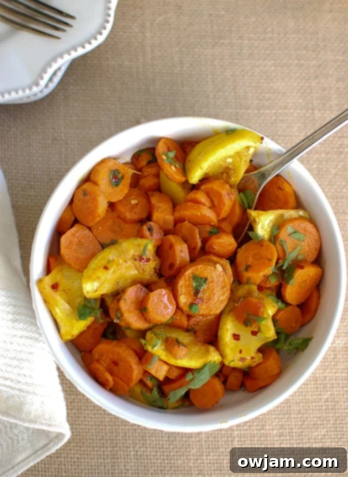 Moroccan Spiced Roasted Carrots 2 Moroccan Roasted Carrots, a vibrant and flavorful side dish served in a rustic bowl.